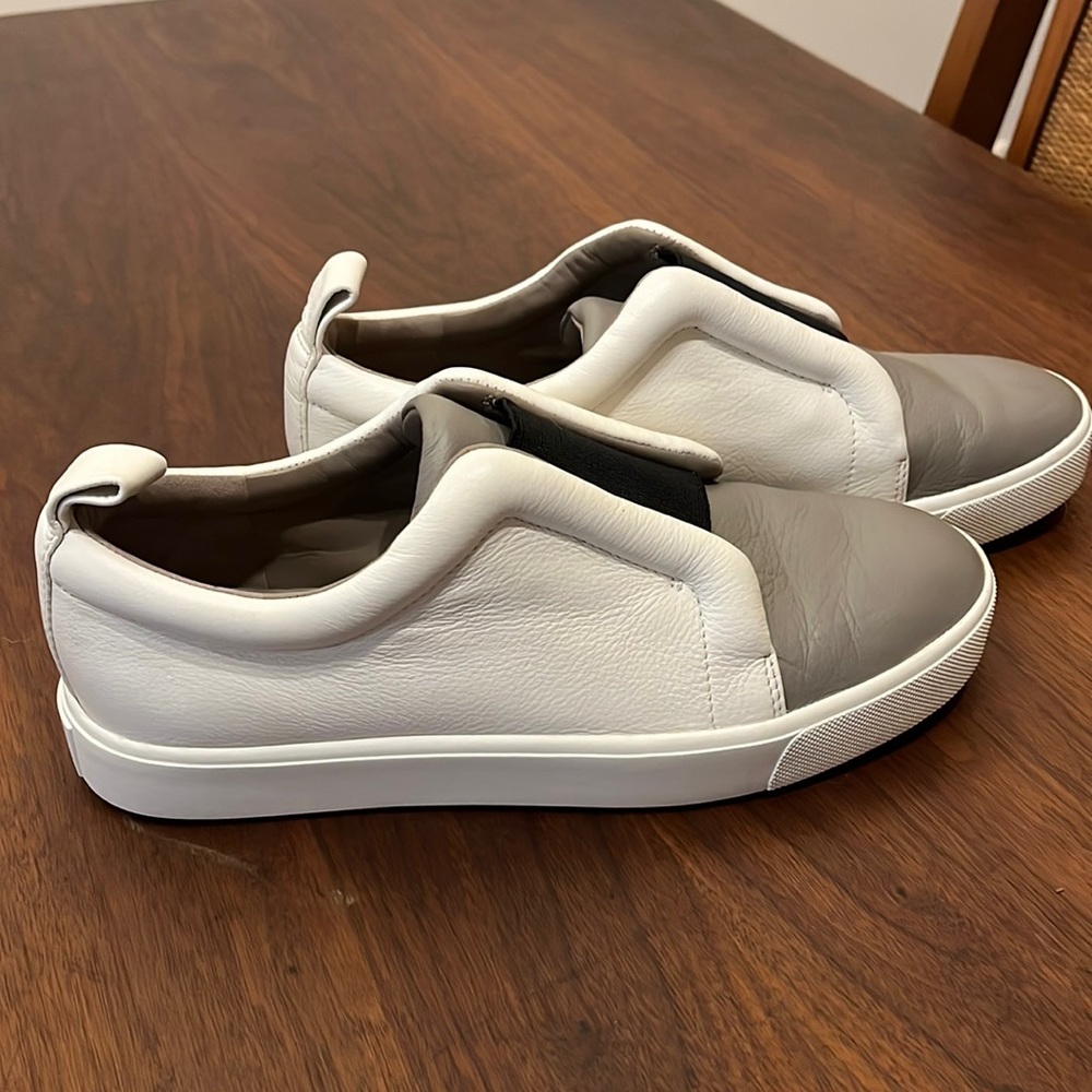 Vince size 6 slip on white and grey leather sneakers.